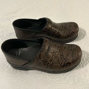 Dansko brown embossed leather professional clogs.